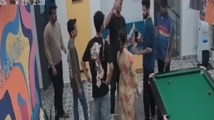 Kerala Woman Harassed at Bengaluru Hostel, Police Register Case CCTV screenshot showing a confrontation between a man and a woman inside a Bengaluru hostel common area