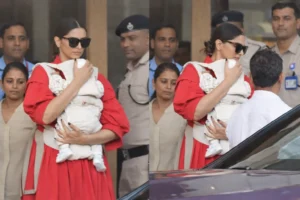 Deepika Padukone Reflects on Motherhood Journey Actor Deepika Padukone holding her infant while stepping out in Mumbai, surrounded by security personnel