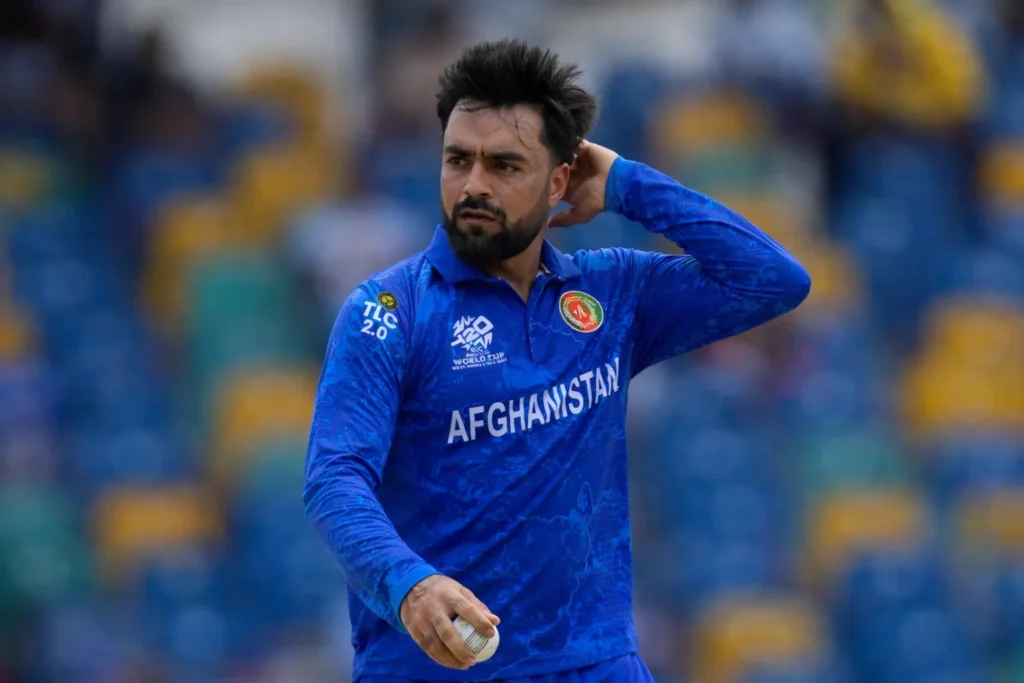 Rashid Khan’s Afghanistan Captaincy Under Review Afghanistan cricketer Rashid Khan holding a cricket ball during an international match.